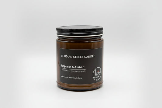 Meridian Street Candle jar with Bergamot & Amber fragrance on a gray background