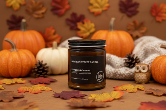 Meridian Street Candle jar with 'Pumpkin & Caramel' scent on a gray background
