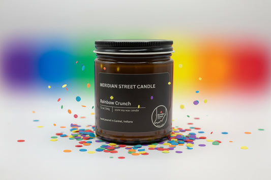 Meridian Street Candle Rainbow Crunch candle with colorful confetti on a white background